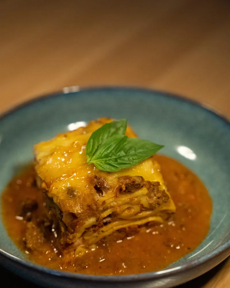 Homemade lasagna with fresh basil