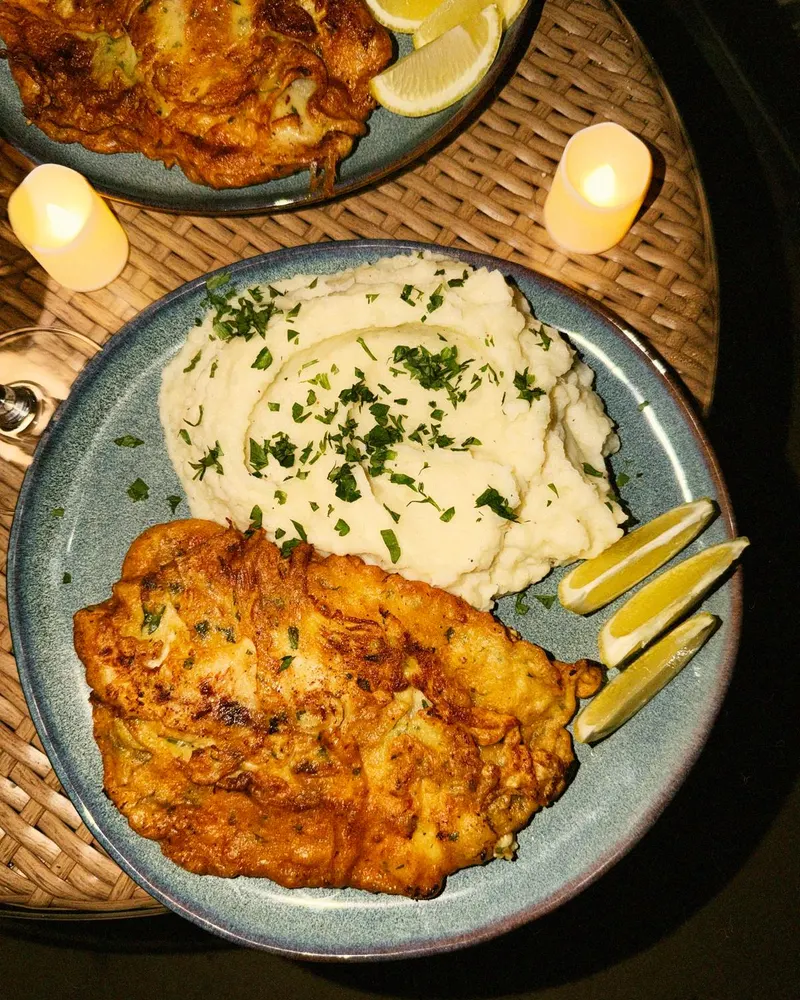 Chicken milanese with mashed potatoes by candlelight